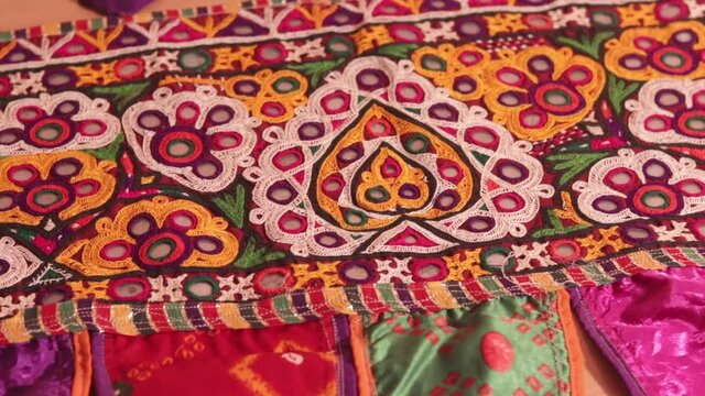 Handicraft items hd footage,embroidery work typical of the Ahir tribe in Gujarat,india,Rajeshthan India embroidery close up view,handwork embroidery,
