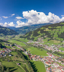 Fototapeta na wymiar Aerial drone shot of Zillertal valley with clouds in Tyrol Austria summer