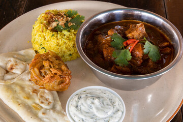 Rogan Josh Indian Curry with Pilaf rice and Naan bread
