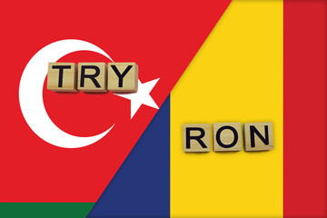 Turkey and Romania currencies codes on national flags background