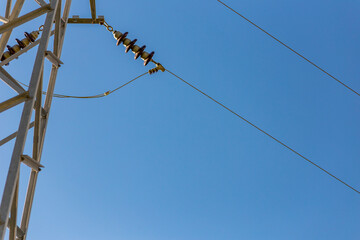 Old electricity pole and blue sky in Turkey.