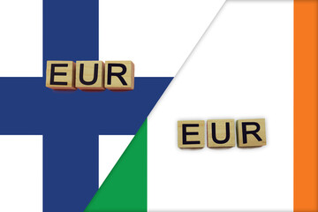 Finland and Ireland currencies codes on national flags background