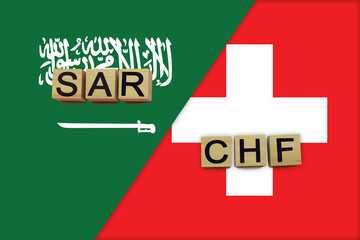 Saudi Arabia and Switzerland currencies codes on national flags background