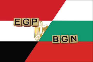 Egypt and Bulgaria currencies codes on national flags background