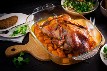 Homemade baked duck. Crispy whole roast duck. Thanksgiving or Christmas dinner. Roast duck with...