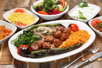Grilled lamb skewers served with grilled tomato and pepper