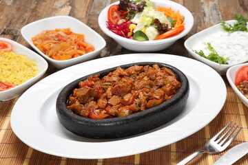 meat skewers on the tile turkish guvec