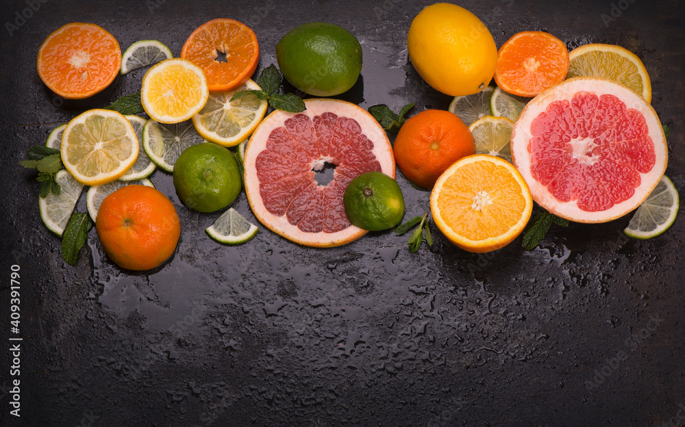 Sticker Citrus background. Fresh citrus fruits - Lemons, oranges, limes, grapefruits on wooden background.