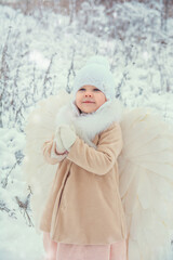 winter, snow, cold, child, woman, happy, portrait, white, fun, hat, young,  winter angel, angel, christmas angel, people, baby playing