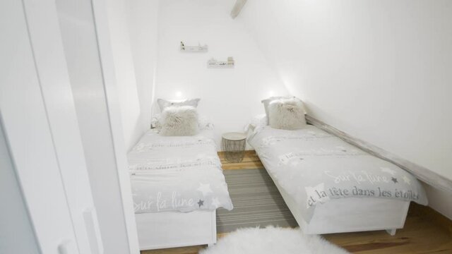 clean and comfortable interior design indoor double single beds in a kids bedroom without people present.

Small air bnb located in the french pyrenees.