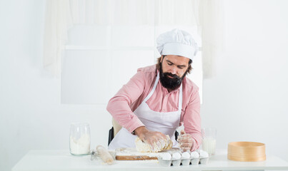 skilled baker use kitchen utensils for cooking. male chef in hat prepare healthy meal. handsome man with beard moustache cooking food. professional restaurant cook baking. Fragrance of deliciousness