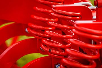 Industrial spring at agricultural machine