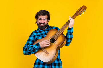 music and vocal. playing the guitar on party. old fashioned bearded hipster play string instrument. man musician in checkered shirt. confident singer with classical acoustic guitar