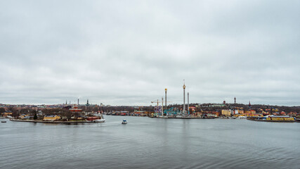 Fototapeta na wymiar A panoramic view on shoreline in Stockholm from Fjallgatan view point on a cloudy winter day