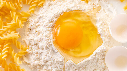 broken egg in flour and pasta