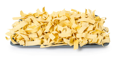 raw pasta noodles on white isolated background
