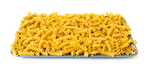 raw pasta fusilli on white isolated background