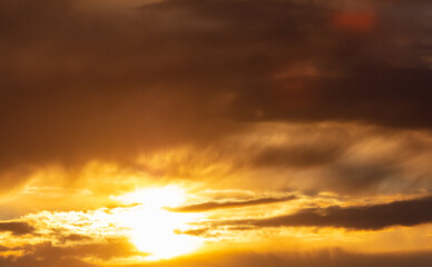 Golden clouds in the sky at sunset