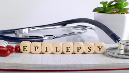 EPILEPSY word made with building blocks, medical concept background.