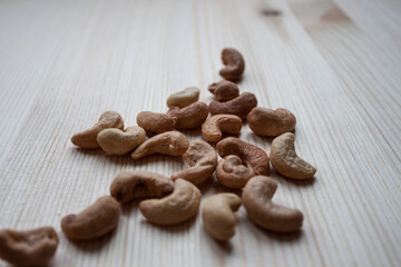 Organic Cashew nuts, close-up, isolated on white background.