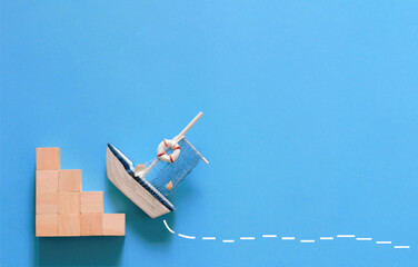 Business Concept, New challenge, anything possible.  The sailboat tries to cross over the barrier.