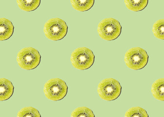 Kiwi isolated on green background. Half of kiwi. Kiwi pattern. Food photography.
