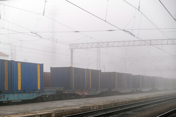 Fototapeta na wymiar Cargo Train Moving On Platform Freight Train Passing Through Station.