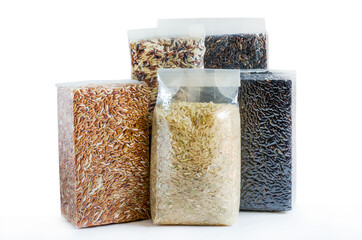 Group of organic rice seeds in plastic or vacuum package on white background