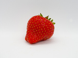 Single strawberry isolated on a white background
