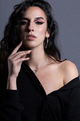 Obraz premium portraits of beautiful woman with black hair on gray background