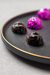 homemade dark chocolates served on a plate 