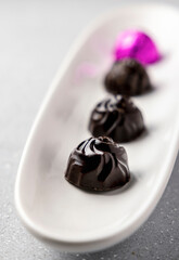 homemade dark chocolates served on a plate 