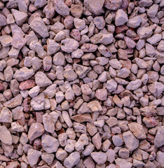 Stone background. blue gravel. Granite texture. The rocky road. Construction material. The texture of the stones. Wallpaper with fine gravel.