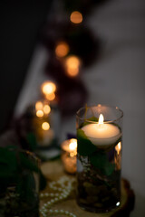 Candle lit ; candle light decorations with bokeh light in the background ; romantic