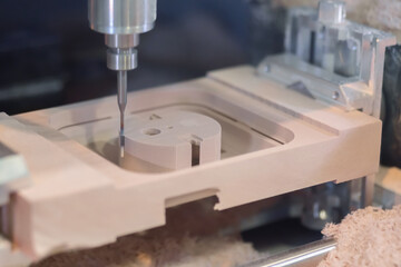 Automated cnc milling machine cutting wooden workpiece from wood pulp, making 3d model at...