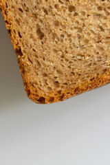 Wheat-rye bread with bran, fresh, sliced.
