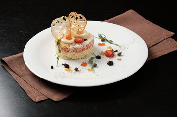 Mimosa salad on a black background