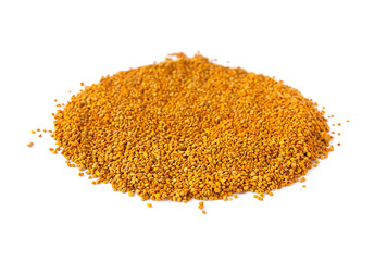 Crumbled bee pollen granules on white background.