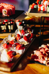Table with casseroles and canapes on the terrace