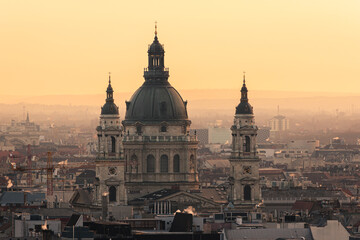 Fototapeta na wymiar The St Stephen's Basilica and Budapest cityscape at sunrise or sunset in Hungary