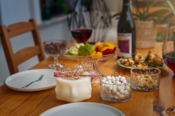 Wine table concept. Serving dinner on the outdoor veranda. Summer mood. Two glasses of red wine and a bottle on the table. Romantic valentines day concept
