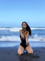 Young woman having fun on the beach