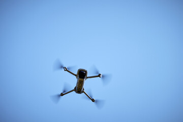 drone in the sky, showing the motion of the propellers