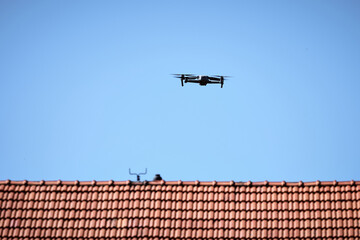 Drone flying over the roof of a retro house