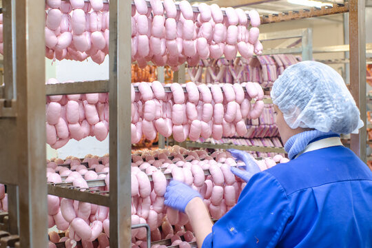 Sausage. Sausage production line. Process of sausage manufacturing. Industrial manufacturing of sausages. Meat shop
