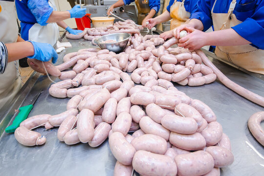 Sausage. Sausage production line. Process of sausage manufacturing. Industrial manufacturing of sausages. Meat shop