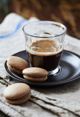 Coffee in glass cup on rustic wooden background. Close up.	