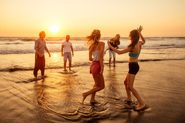 multicultural multinational happy people running into the sun carefree and happiness, vacation on sea