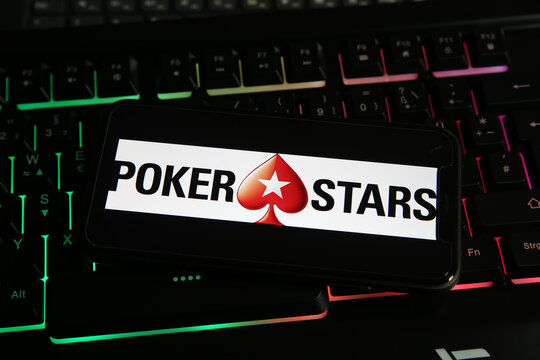 Viersen, Germany - January 9. 2021: Closeup of smartphone screen with logo lettering of online betting provider betstars pokerstars on computer keyboard