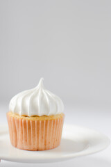 Cupcake with a white meringue frosting